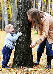 Image showing Mother and son play hide-and-seek