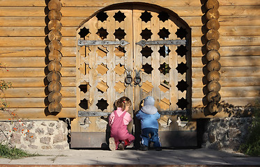 Image showing Children near the wooden gates