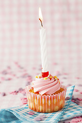 Image showing Pink muffin with candle