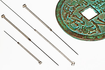 Image showing acupuncture needles with chinese coin