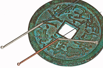 Image showing acupuncture needles on chinese coin