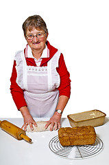 Image showing pensioner baking whole grain bread