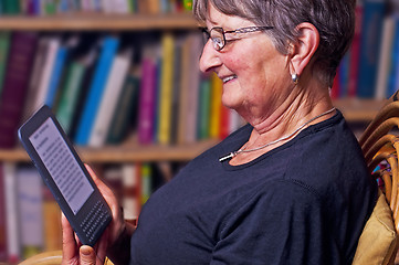 Image showing pensioner with e-book reader