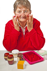 Image showing pensioner with cosmetic products