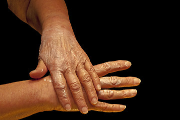 Image showing hands with creme