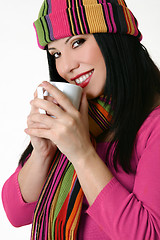 Image showing Winter styled woman holding a coffee mug