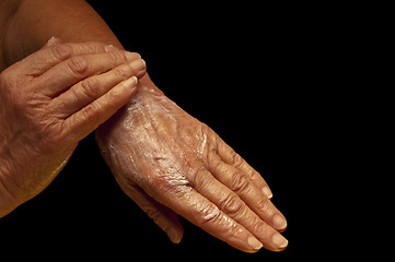 Image showing hands with creme