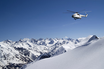 Image showing Helicopter in snowy mountains