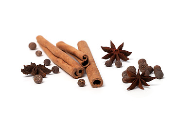 Image showing Black peppercorns, anise stars and cinnamon sticks