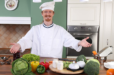 Image showing Young chef preparing lunch in kitchen