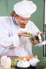 Image showing Funny young Chef with Brussels sprouts