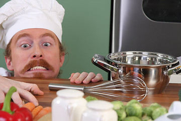 Image showing Funny young chef with a pot