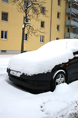 Image showing car covered with snow in winter 