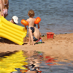 Image showing Mother with child in the sand