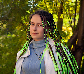 Image showing girl with pigtails with a Mona Lisa smile