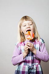 Image showing Little girl with lollipop