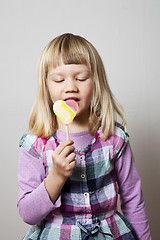 Image showing Little girl with lollipop