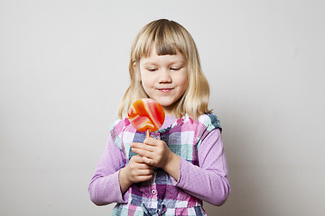 Image showing Little girl with lollipop