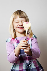 Image showing Little girl with lollipop