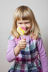 Image showing Little girl with lollipop