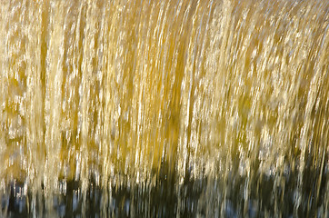 Image showing Flow dam water closeup beautiful sunlit background 