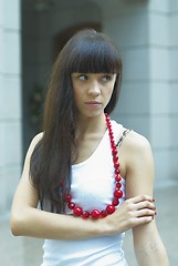 Image showing Girl with red beads