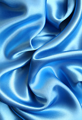 Image showing Smooth elegant blue silk as background 