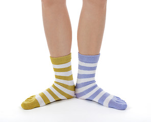 Image showing Funny legs in socks of different colors