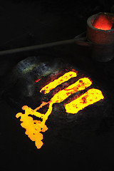 Image showing Foundry - molten metal in mould - leftover