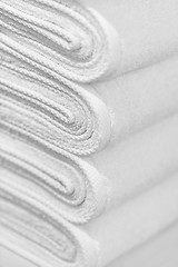 Image showing Stack of new white towels close-up - background