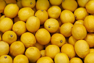 Image showing Lemons on the market counter - background