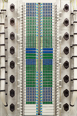 Image showing fiber optic rack with high density of blue and green SC connectors