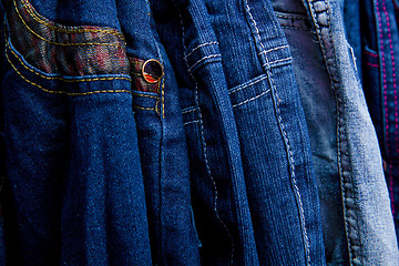 Image showing Denim pants on a hanger for children in the store