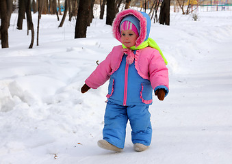 Image showing baby girl walking in winter park