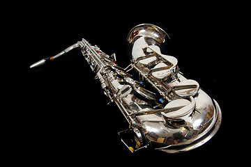 Image showing silver saxophone isolated on the black background