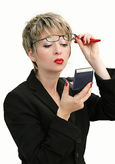 Image showing Businesswoman checking her makeup