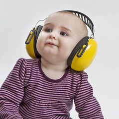 Image showing baby with ear protection