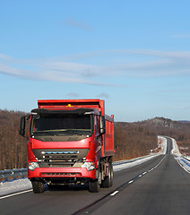 Image showing The red truck on a winter road.