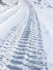 Image showing Traces from wheels of the  car on snow