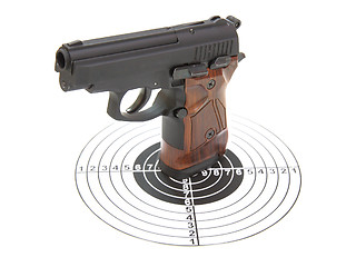 Image showing The pistol with the brown handle