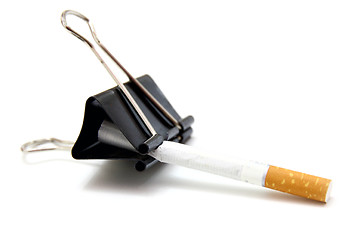 Image showing broken cigarettes  metal clip