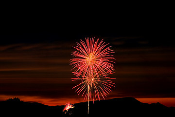 Image showing Firecrackers In The Sky During Sunset