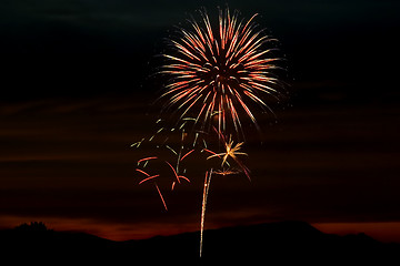 Image showing Firecrackers In The Sky During Sunset