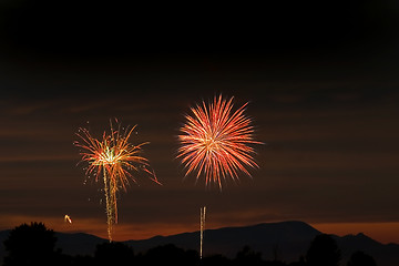 Image showing Firecrackers In The Sky During Sunset