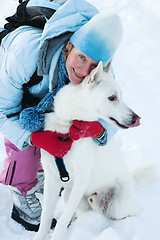 Image showing The woman with a dog in winter on walk