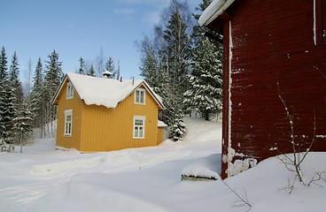 Image showing Yellow house and red shed