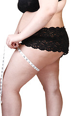 Image showing Big girl measuring tights.