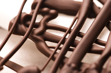 Image showing Chocolate traces on a white paper