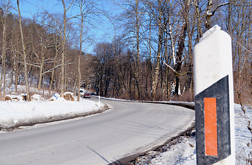 Image showing Road curve mark column reflector in snowy winter 