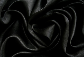 Image showing Smooth elegant black silk as background